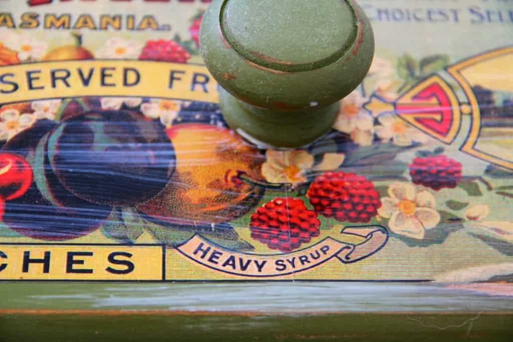 Mod podge over antique can label on drawer