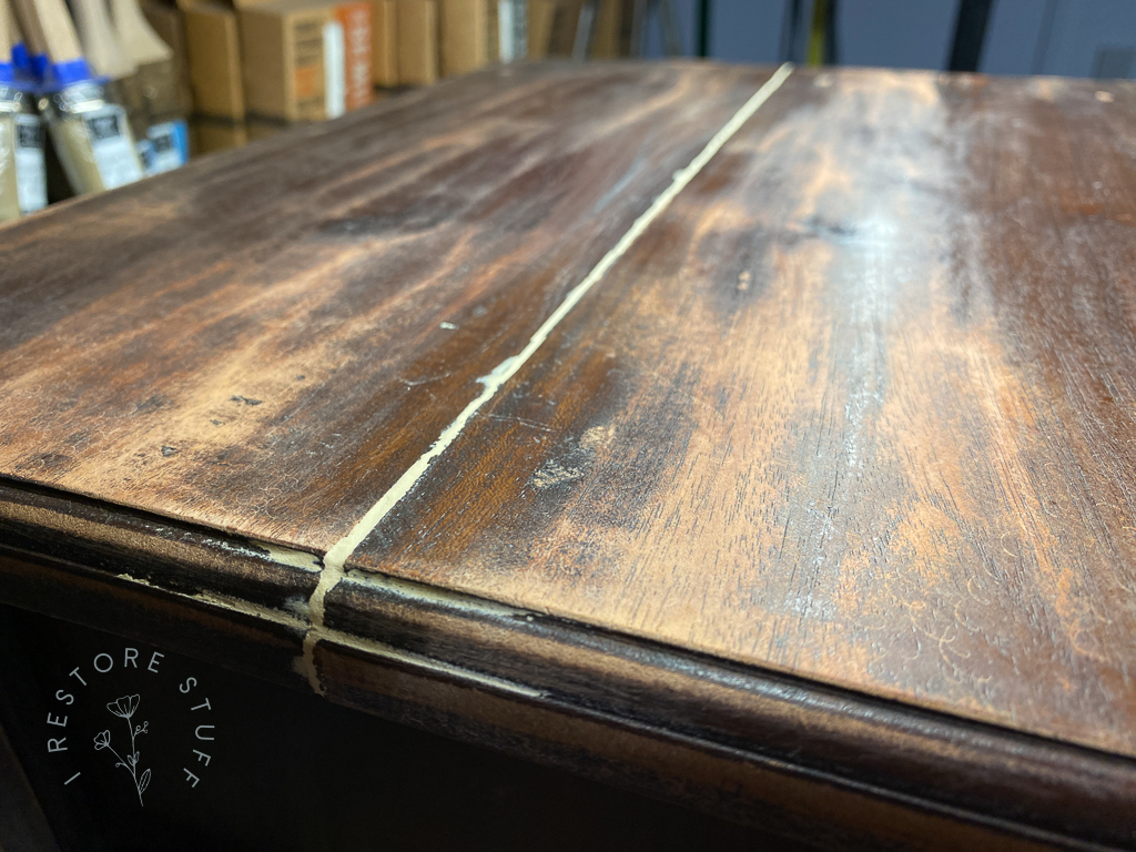 filled crack on top of cupboard